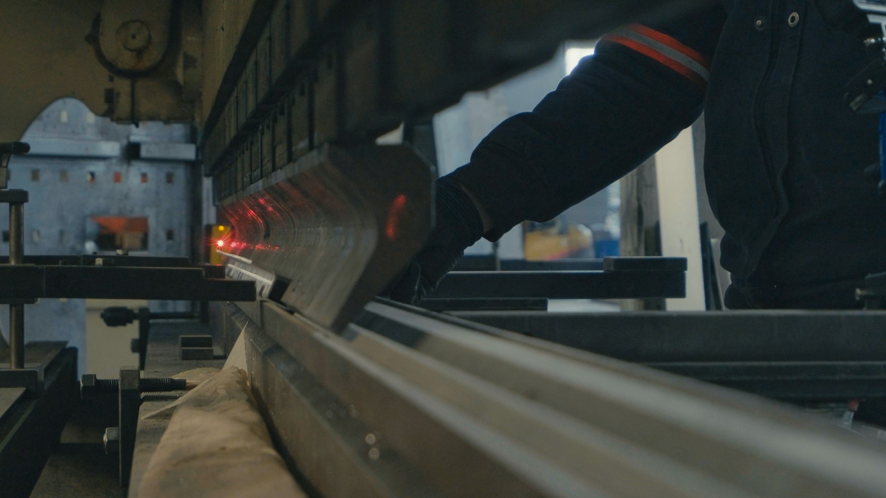 Representative manufacturing worker operating precision machinery
